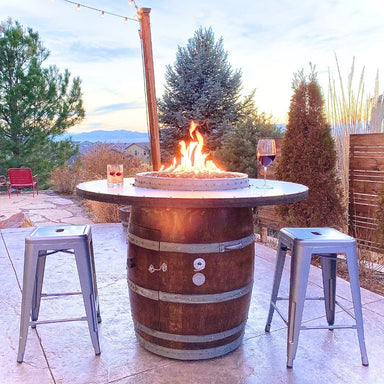 wine barrel dude full barrel gas fire pit table out in the yard at a backyard