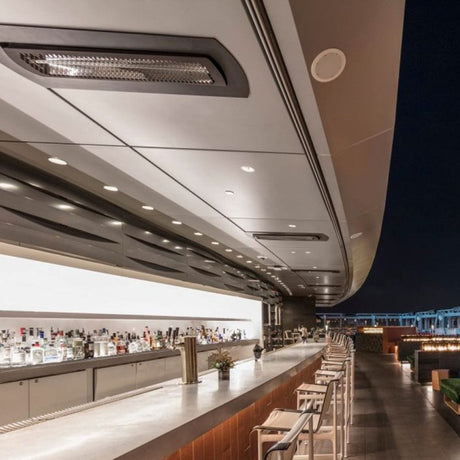 Black bromic tungsten smart-heat black electric patio heater flush mounted at a bar outdoors