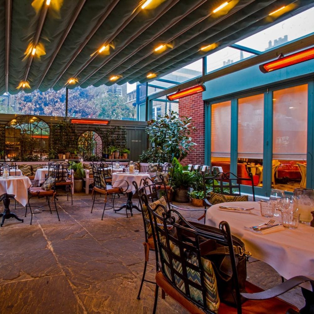 Black bromic tungsten smart-heat electric patio heater at a restaurant in california