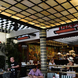Black bromic tungsten smart-heat electric patio heater in restaurant patio