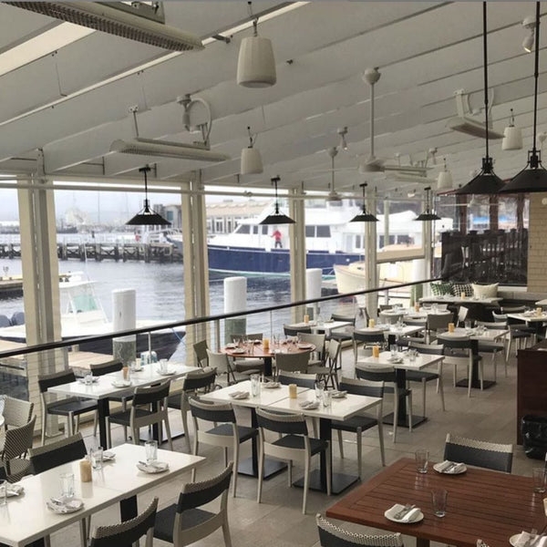 Bromic White Tungstan Electric Heaters Mounted Overhead in Restaurant