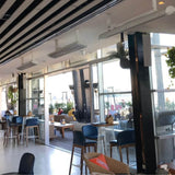 White bromic tungsten smart-heat electric patio heater indoors in a restaurant in australia