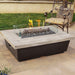 American Fyre Designs Contempo 54" Reclaimed Wood Rectangular Gas Fire Pit Table In a Patio