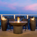 American Fyre Designs Lotus Fire Table with Wave Fire Urns