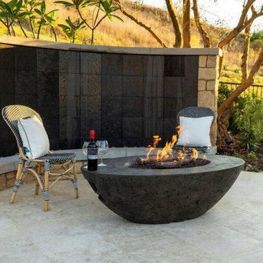 American Fyre Designs Calais Fire Pit Table in Outdoor Patio with Wine Bottle and Glasses