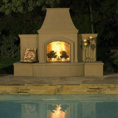 American Fyre Designs Grand Phoenix 113-Inch Free Standing Outdoor Gas Fireplace in Cafe Blanco by the Pool