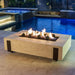 American Fyre Designs Iron Saddle Fire Pit Table with Fyre Spheres in Pool Area
