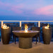 American Fyre Designs Wave  Fire Urns with Lotus Fire Table in Balcony