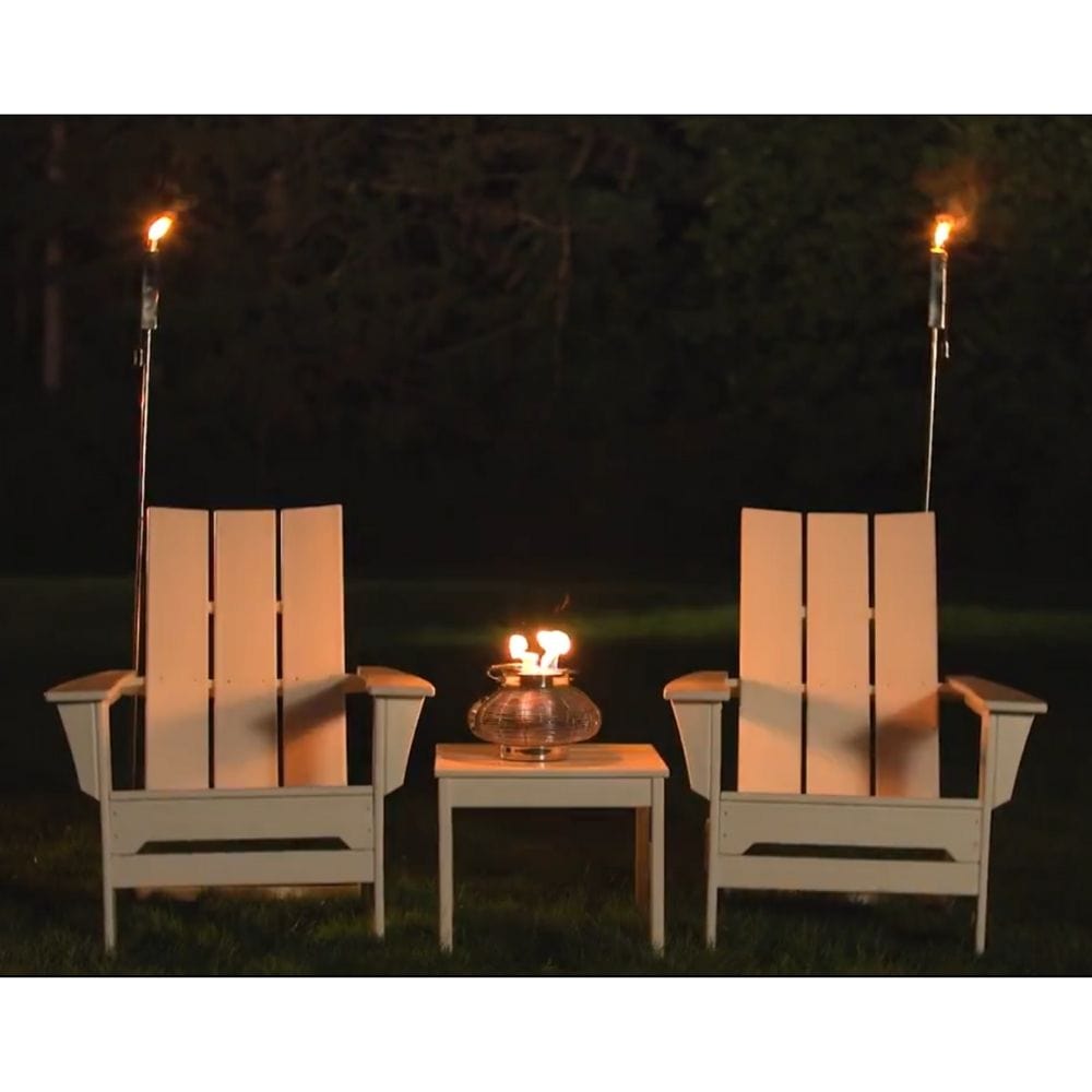 Anywhere Fireplace 65-Inch Polished Stainless Steel Rectangular Torches Behind Chairs