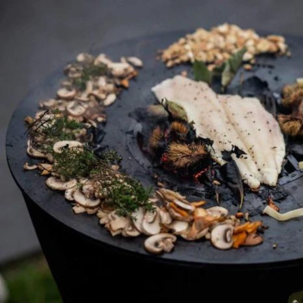 grilling seafood and vegetables on the arteflame one series 20-inch fire pit