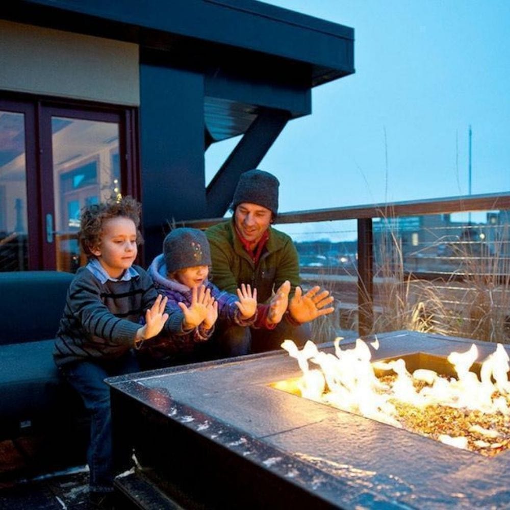Father with Sons Warming by Fire Pit