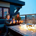 Father with Sons Warming by Fire Pit