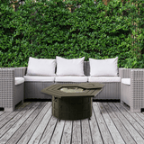 AZ Patio Heaters Hammered Bronze Hexagon LP Fire Pit Table in lush garden setting