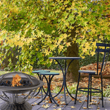 AZ Patio Heaters Scroll Design 30-Inch Round Fire Pit in a garden