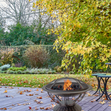 AZ Patio Heaters Scroll Design 30-Inch Round Fire Pit in a garden