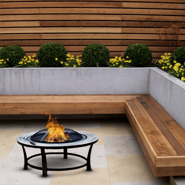 AZ Patio Heaters Slate Tile 40-Inch Round Fire Pit in backyard