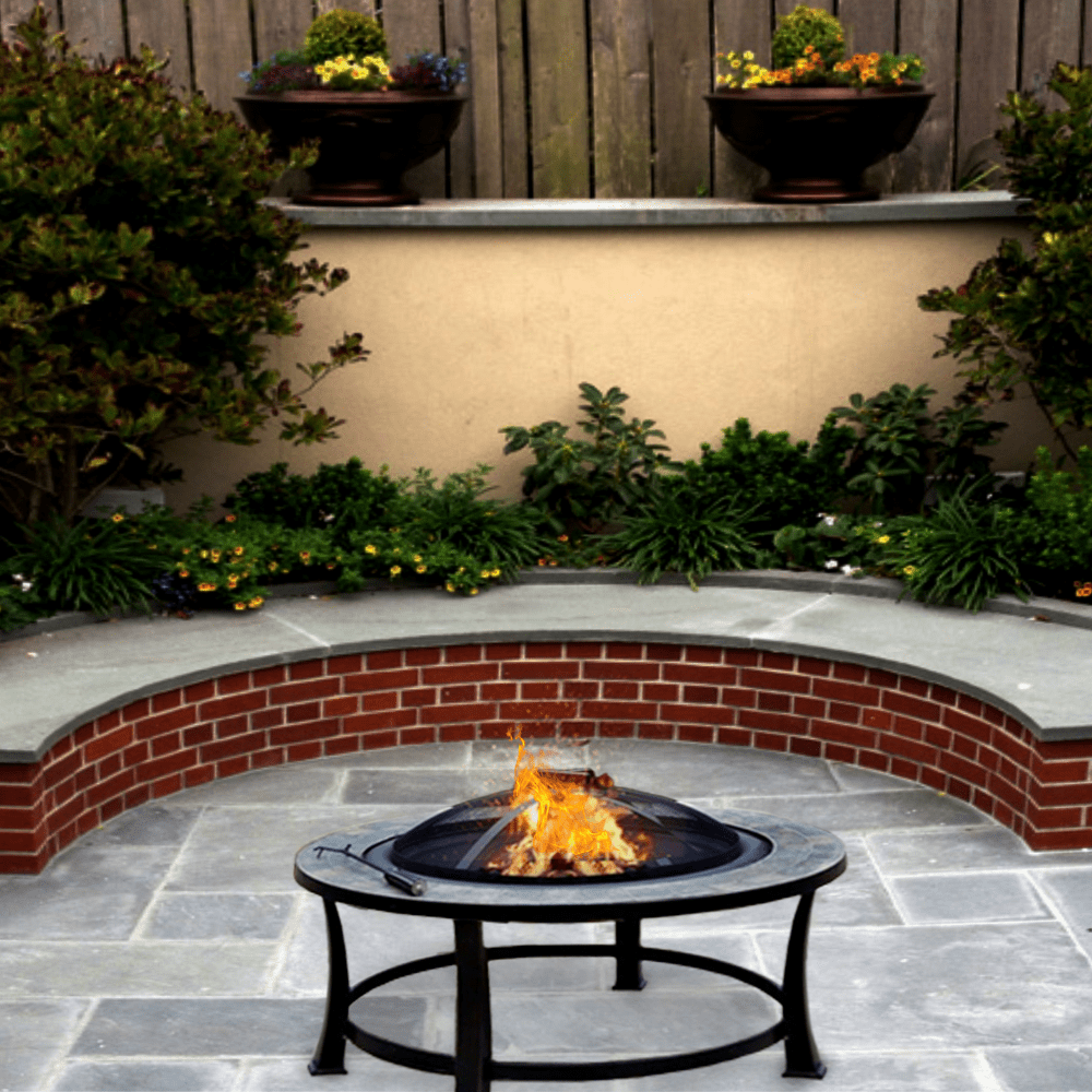 AZ Patio Heaters Slate Tile 40-Inch Round Fire Pit in backyard