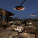 several bromic eclipse smart-heat electric patio heaters in use at night