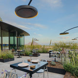 several bromic eclipse smart-heat electric patio heaters at an outdoor cafe