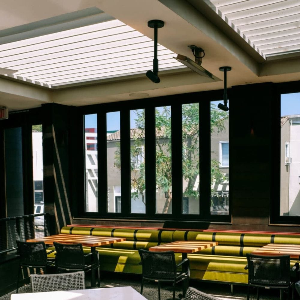 a sleek electrical patio heater situated in a cafe in california