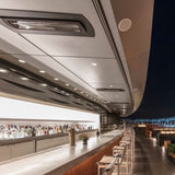 bromic tungsten smart-heat black electric patio heater flush mounted at a bar outdoors