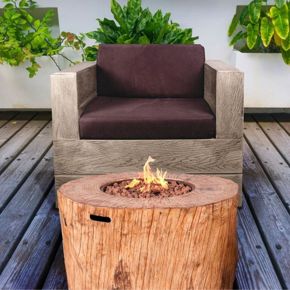 Direct Wicker 40-Inch Round Tree Stump LP Fire Pit Table (PAG-2180) in Front of Patio Chair