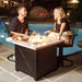 Endless Summer Mason 30" Square Outdoor LP Fire Pit Table in a Poolside Area