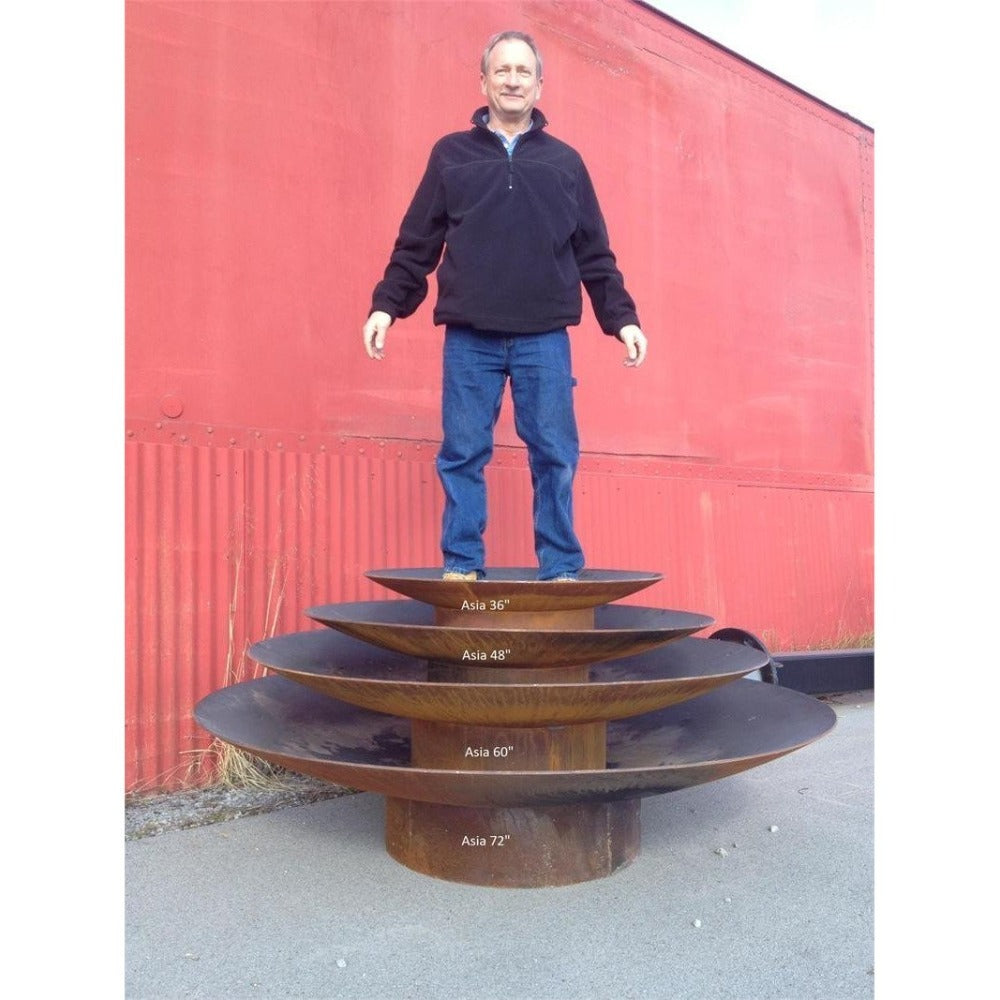 Fire Pit Art Asia Series Fire Pits Stacked with Rick Wittrig Standing on Top of Them