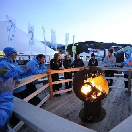 Fire Pit Art Third Rock - Globe Shaped 36" Handcrafted Carbon Steel Fire Pit In A Snowy Area