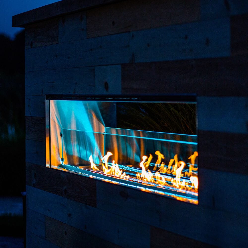 firegear kalea bay vent free outdoor gas fireplace with blue led lights at night
