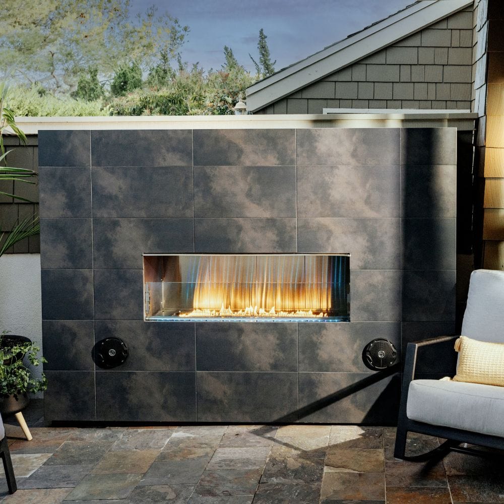 firegear kalea bay vent free gas fireplace with black tiles surround in backyard