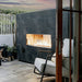 firegear kalea bay outdoor gas fireplace with black tiles surround in modern patio