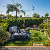 firegear kalea bay vent free gas fireplace with white surround in modern backyard