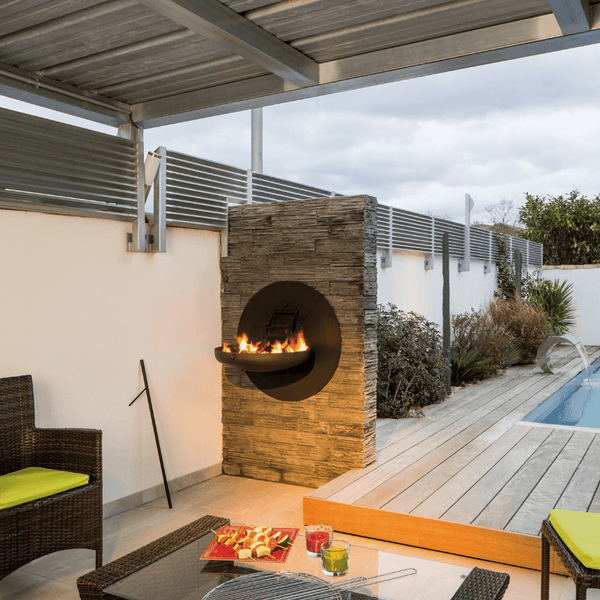 Focus Sigmafocus Wood Burning Fire Pit Grill in patio