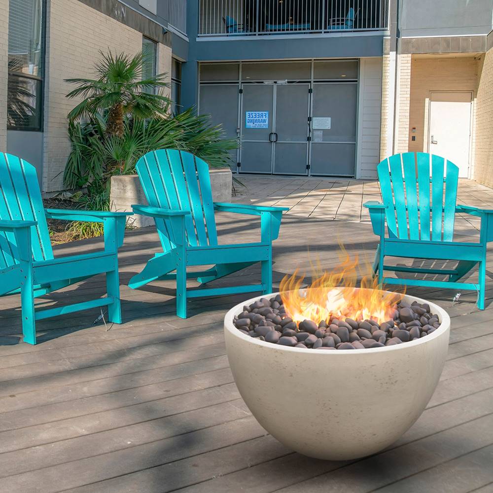 Modern Blaze 36-Inch Round Sahara Sand Concrete Fire Bowl on patio deck