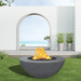 modern blaze round coal fire bowl with smooth surface in a light outdoor setting