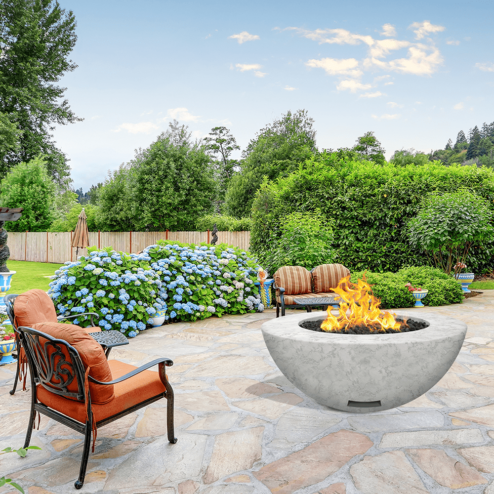 modern blaze round arctic fire bowl with textured surface in a lush garden