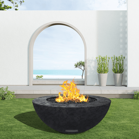 modern blaze round raven fire bowl with textured surface in a light outdoor setting
