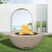 modern blaze round bone fire bowl with textured surface in a light outdoor setting