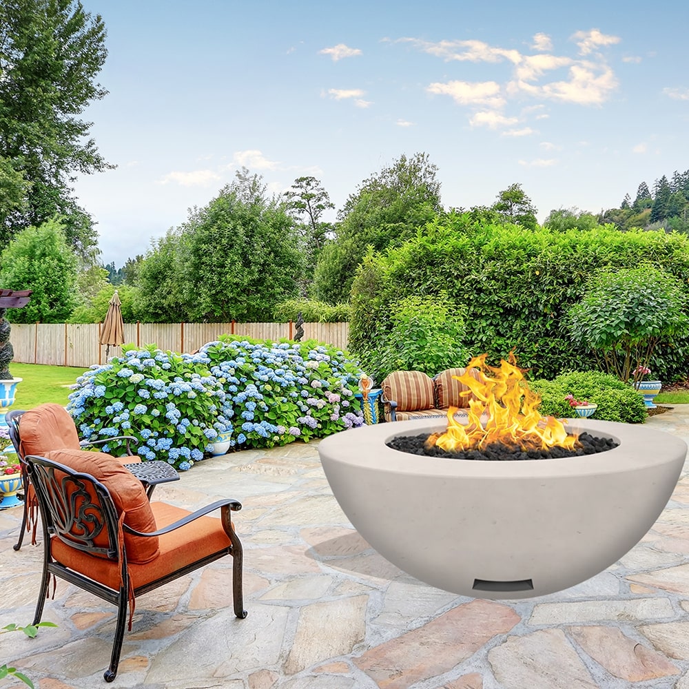 modern blaze round ivory fire bowl with smooth surface in a lush garden