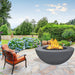 modern blaze round coal fire bowl with smooth surface in a lush garden