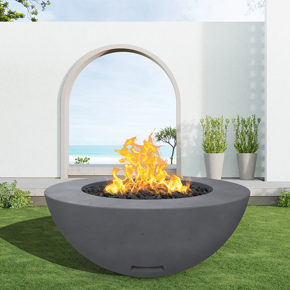 modern blaze round coal fire bowl with smooth surface in a light outdoor setting