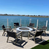 Modern Blaze Oblica Gray Round Concrete Fire Pit Table by the lake