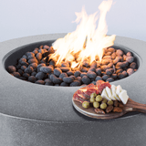 Modern Blaze Oblica Cascade Cliffs Round Fire Pit burn area with vibrant flames