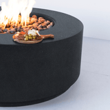 Modern Blaze Oblica Pacific Midnight Round Fire Pit with appetizers on the side