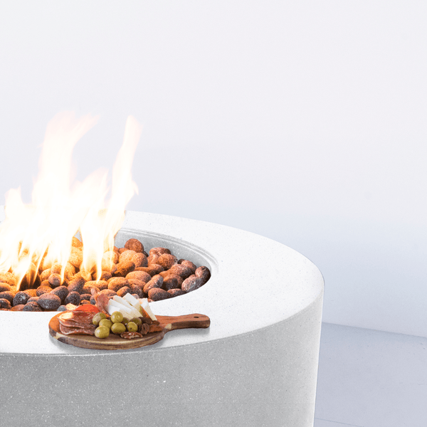 Smooth edges of the modern blaze shasta snow oblica round fire pit