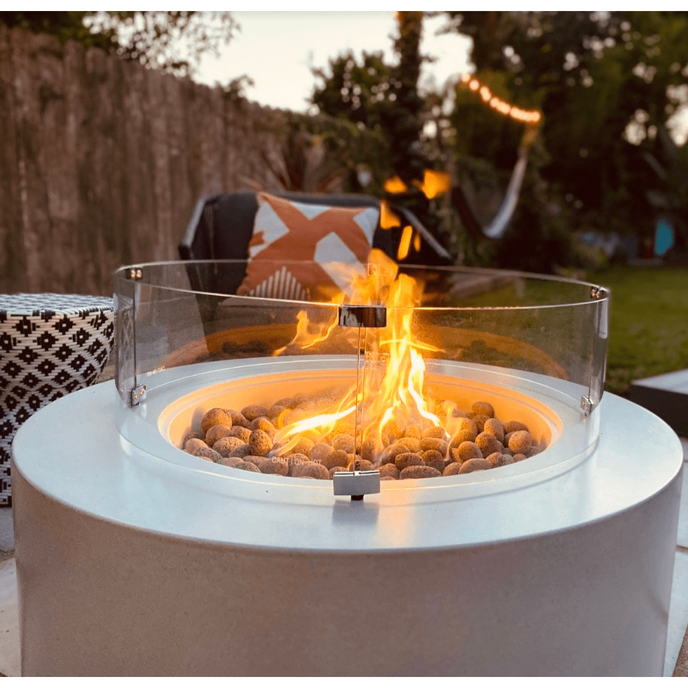 Modern Blaze Oblica Round Fire Pit in backyard