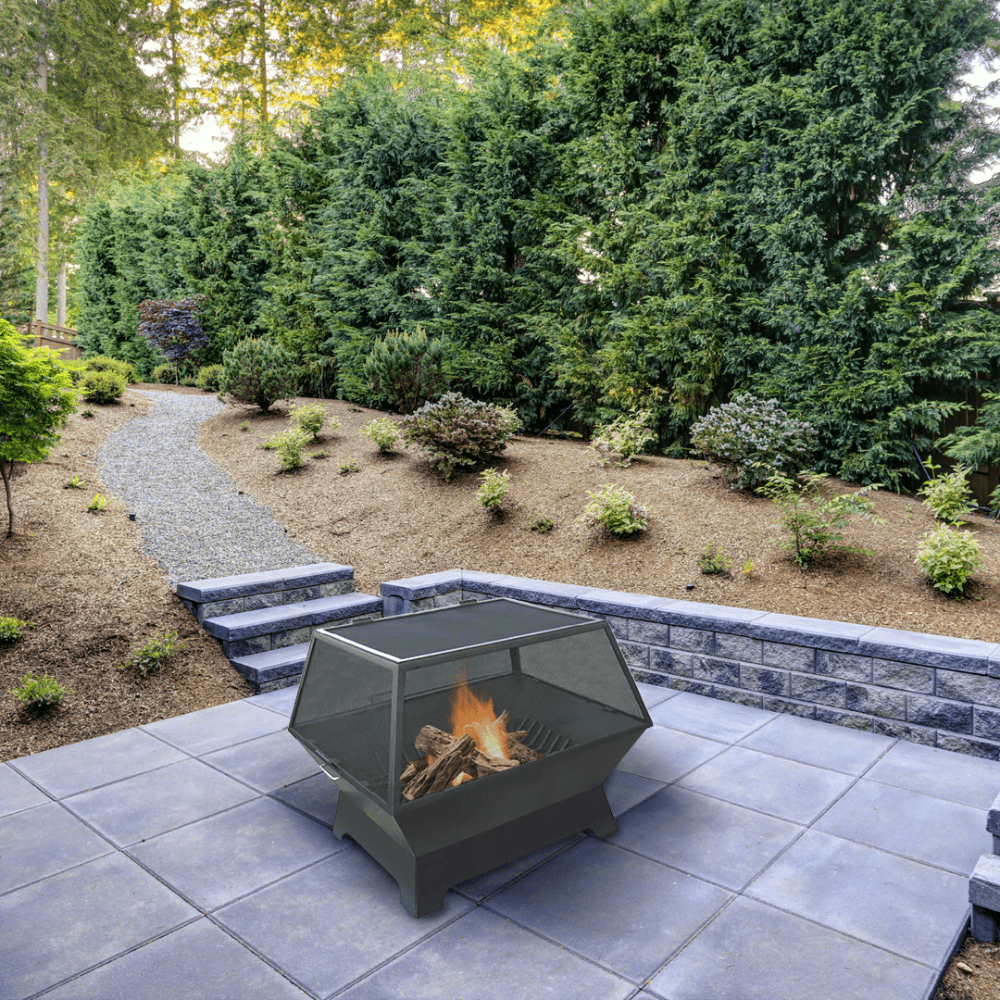 modern blaze rectangular steel fire pit in lush outdoor space