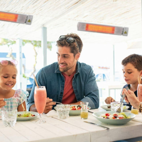 NEL 26" 1500W 120V Indoor/Outdoor Infrared Electric Heater in Restaurant setting