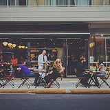 NDUSTRIA NEL Electric Patio Heater at an outdoor cafe